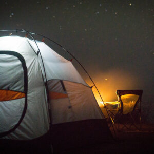 Group of friends enjoying Musandam Khasab beach camping under the stars in Musandam, Oman